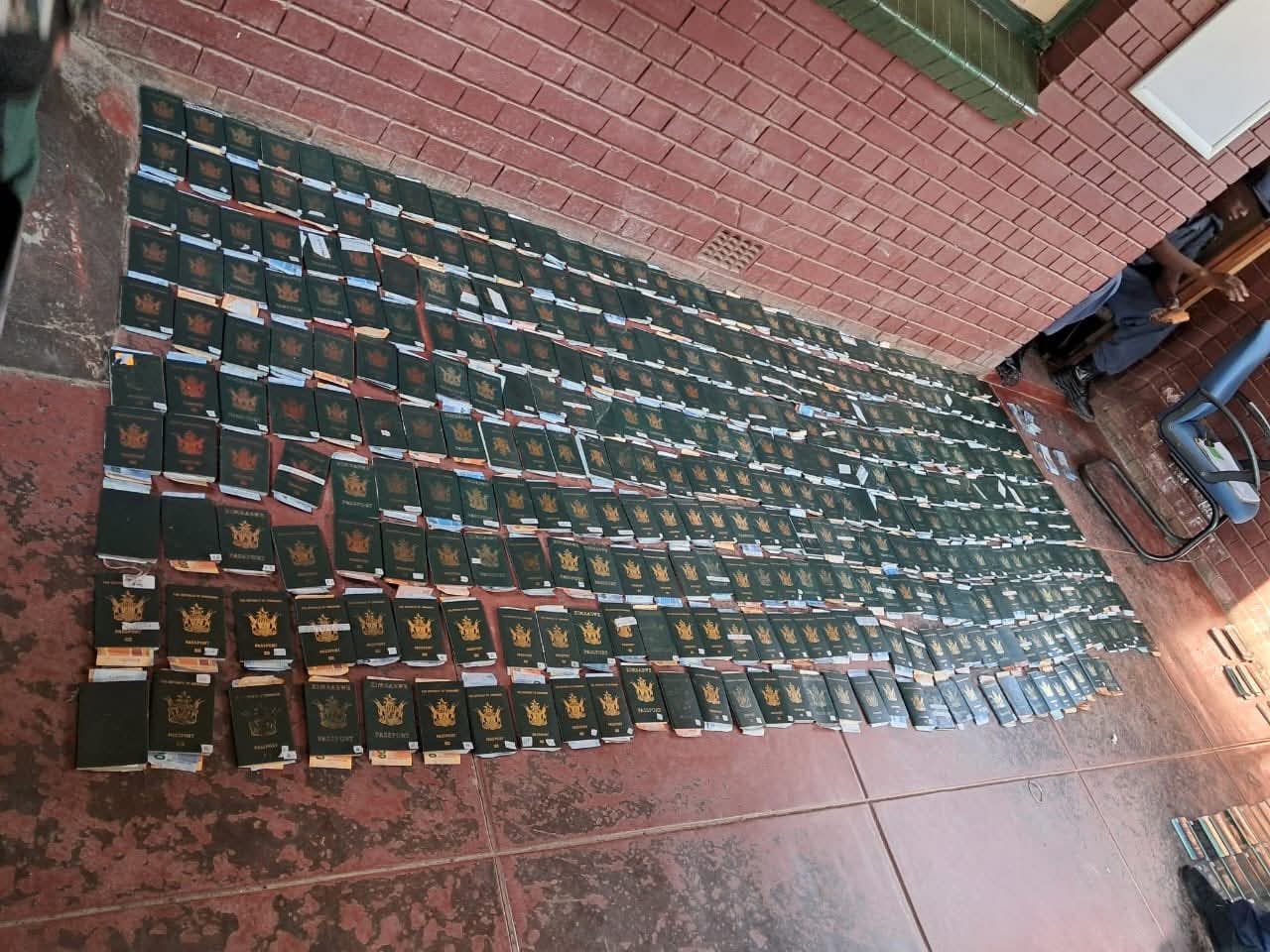 Police Arrest Foreign National with Hundreds of Passports and Cash